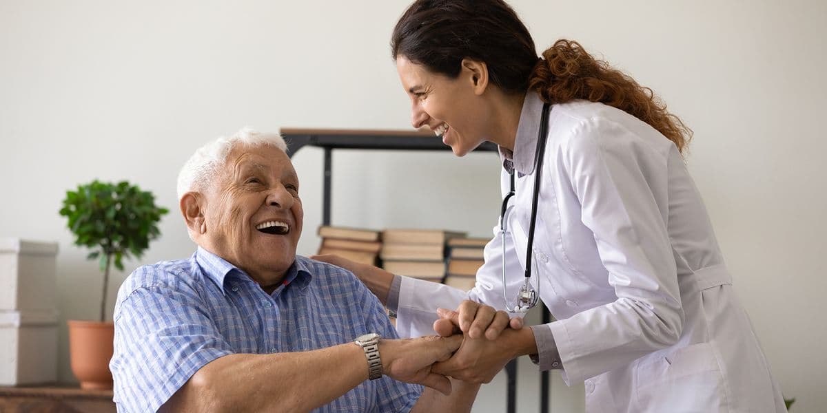 senior man talking to doctor