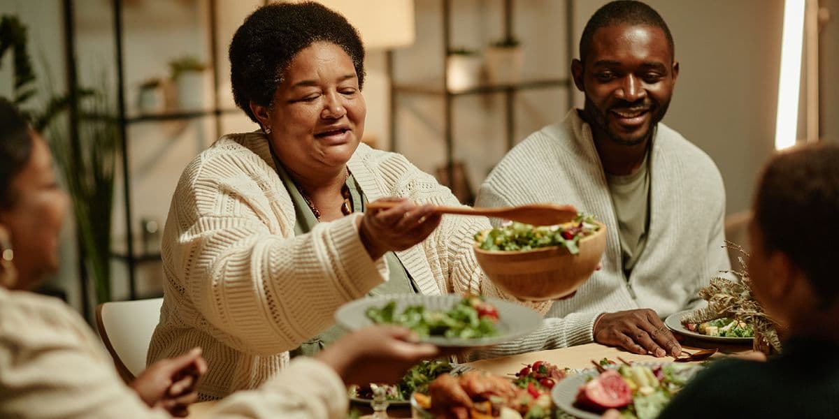 Family gathering together for dinner