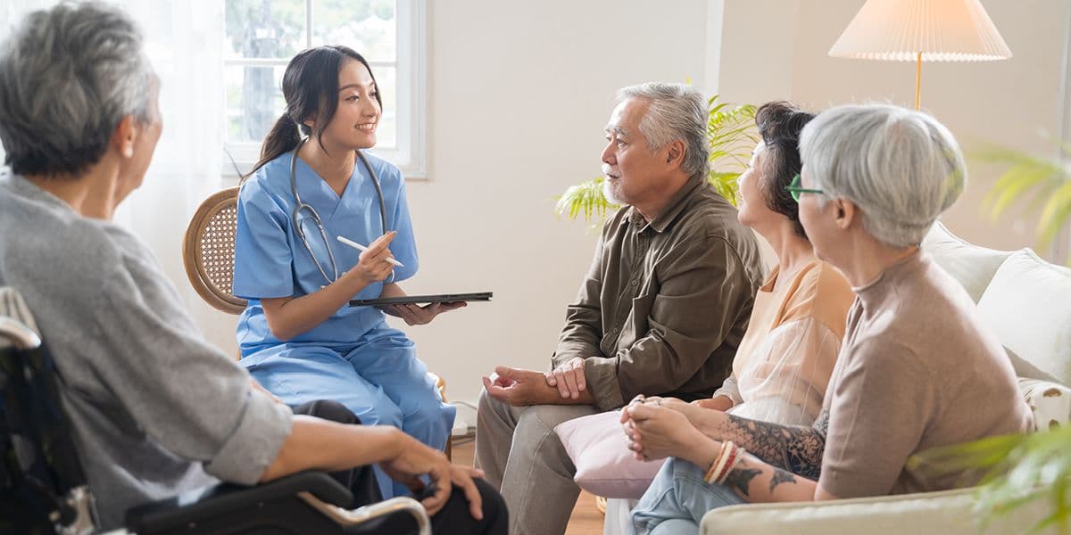 group of seniors talking to doctor