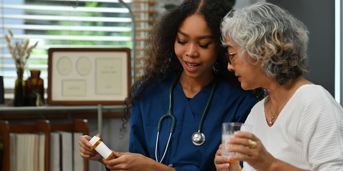 senior woman talking to doctor about medication