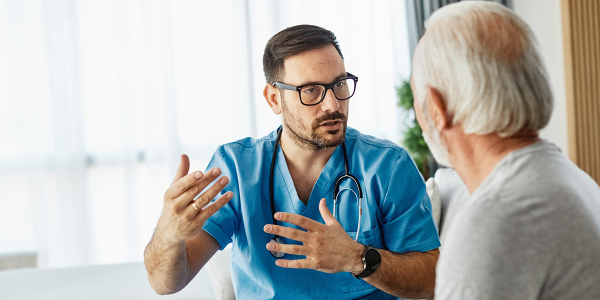 senior man talking to doctor