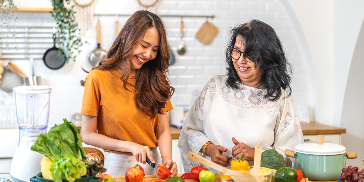 senior woman cooking with family